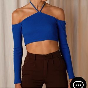 Cropped knit top with tie style halter top, never worn; new condition.